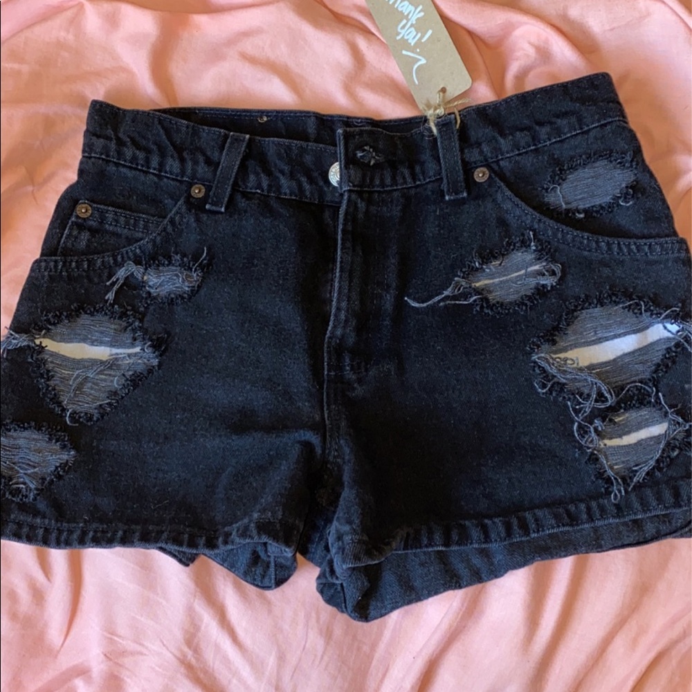 Custom distressed black Levi shorts vintage